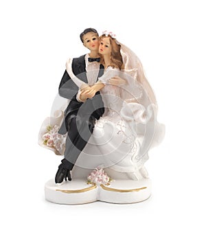 Figurines of a wedding cake on a white background