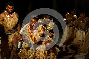 Fijian men dancing a traditional male dance meke wesi in Fiji