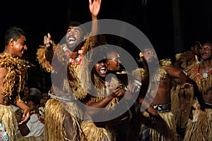 Fijian men dancing a traditional male dance meke wesi in Fiji