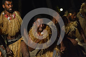 Fijian men dancing a traditional male dance meke wesi the spear