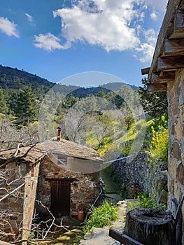 Fikardou village scene with traditional architecture and surrounding landscape