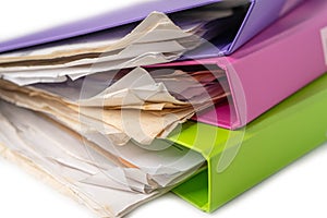 File Folder Binder stack of multi color on table.