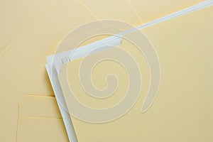 File Folder with Paper on Messy Pile