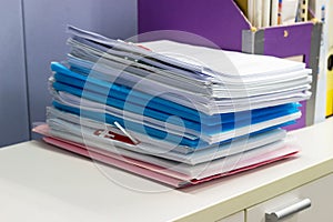 File folder and Stack of business report paper file on the table in a work office, concept document in work