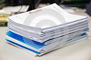File folder and Stack of business report paper file on the table in a work office