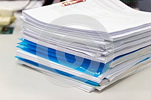 File folder and Stack of business report paper file on the table in a work office
