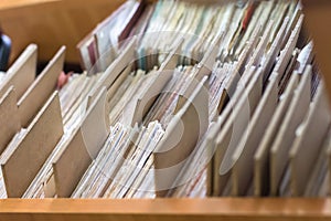 File folders in a file cabinet, card catalog in a library, closeup