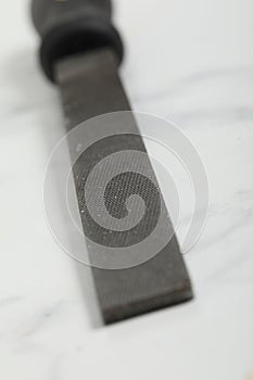 file isolated on a white marble background close up