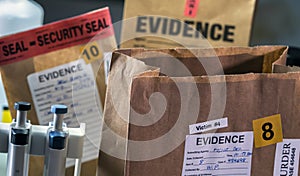 Files and evidence bag in a crime lab
