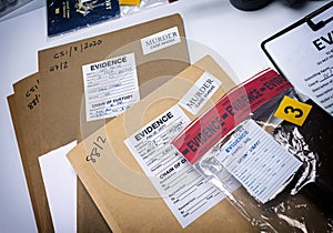 Files and evidence bag in a crime lab