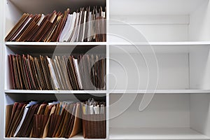 Files Organized on Office Shelf For Clients Papers and Information