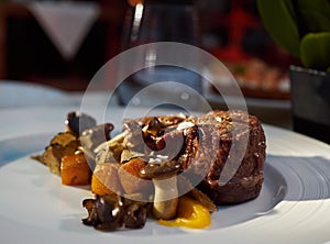 Filet mignon with cubes of baked sweet potato  and mushrooms