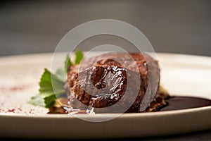 Filet mignon with mashed potatoes and pomegranate sauce, close-up