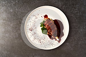 Filet mignon with mashed potatoes and pomegranate sauce, close-up