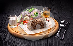 Filet Mignon Steak with garnish on wooden board