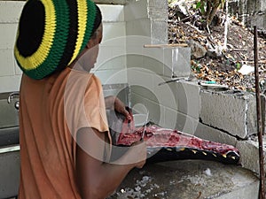 Fileting a large fish in the caribbean