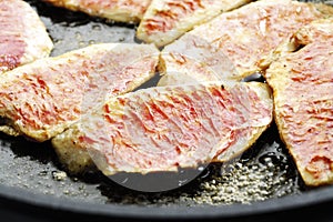 Filets of sea barbel in pan, close-up