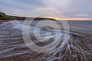 Filey seascape with wave trails, slow shutter to show the waves movement.