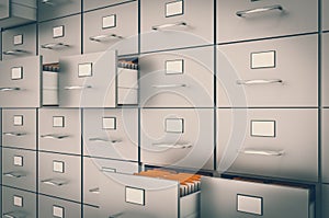 Filing cabinet with yellow folders in an open drawers