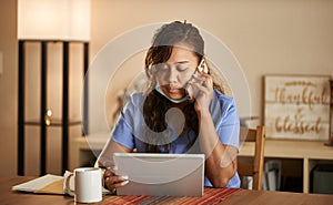 Filipina nurse working from home talking on phone