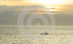 Filipino Banca boats being drenched by a midday rain