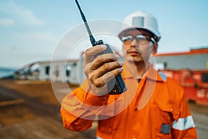 Filipino deck Officer on deck of vessel or ship , wearing PPE personal protective equipment