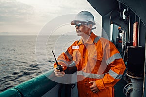 Filipino deck Officer on deck of vessel or ship , wearing PPE personal protective equipment