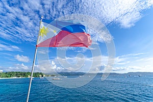 Filipino flag flying in a boat, Boracay