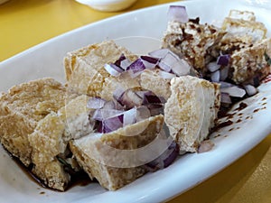 Filipino food, tokwa`t baboy, is a dish made from fried solid soya and fried pork mixed with onions, soy sauce and vinegar. photo