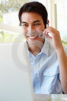 Filipino man using skype photo