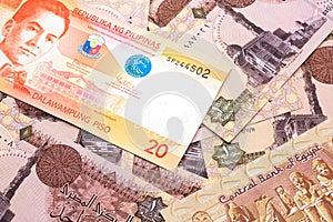 A Filipino piso bill with Egyptian one pound bank notes photo