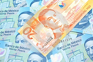 A Filipino piso bill with Mexican twenty peso bank notes