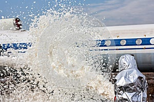 Fill the airplane with fire-fighting foam after emergency landing