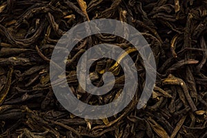 Filled abstract background of tea leaves. Black, green tea close up