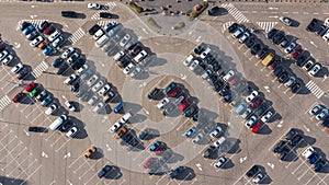 Filled car parking near mall top view on sunny day photo from height