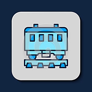 Filled outline Passenger train cars icon isolated on blue background. Railway carriage. Vector