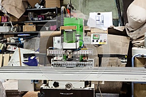 Filler machine to make furniture at carpenters workshop.