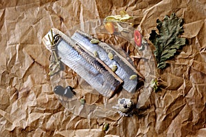 Fillet of Atlantic herring on paper. The view from the top.