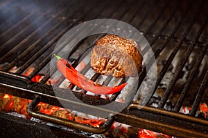 Fillet beef steak on grill with hot pepper. Barbecue