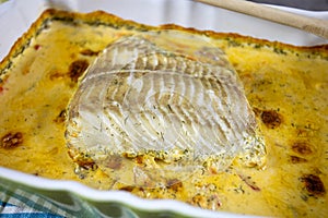 Fillet of coalfish cooked in the oven with sauce