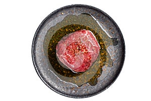 Fillet Mignon prime beef steak, raw dry aged marble meat with herbs and spices ready for cooking. Isolated on white