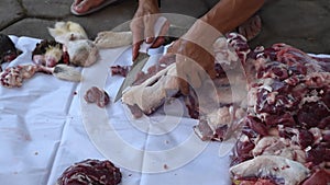 fillet process. chopping meat of sacrifice or qurban in Eid Al Adha. Selective focus.