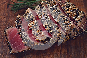 fillet of red tuna meat, fried in sesame seeds, homemade, close-up, no people,