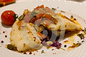 Fillet of sole fish with fresh vegetables, with cherry tomatoes