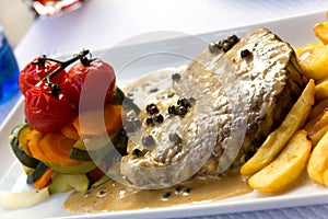 Fillet Steak with French Fries and Pepper Cream Sauce