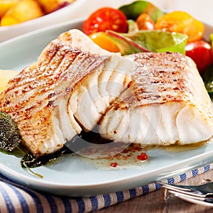 Fillets of savory marinated pollock photo