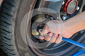 Filling air into a car tire