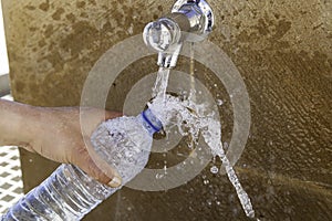 Filling bottle in fountain