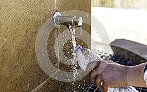 Filling bottle in fountain