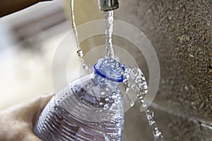 Filling bottle in fountain